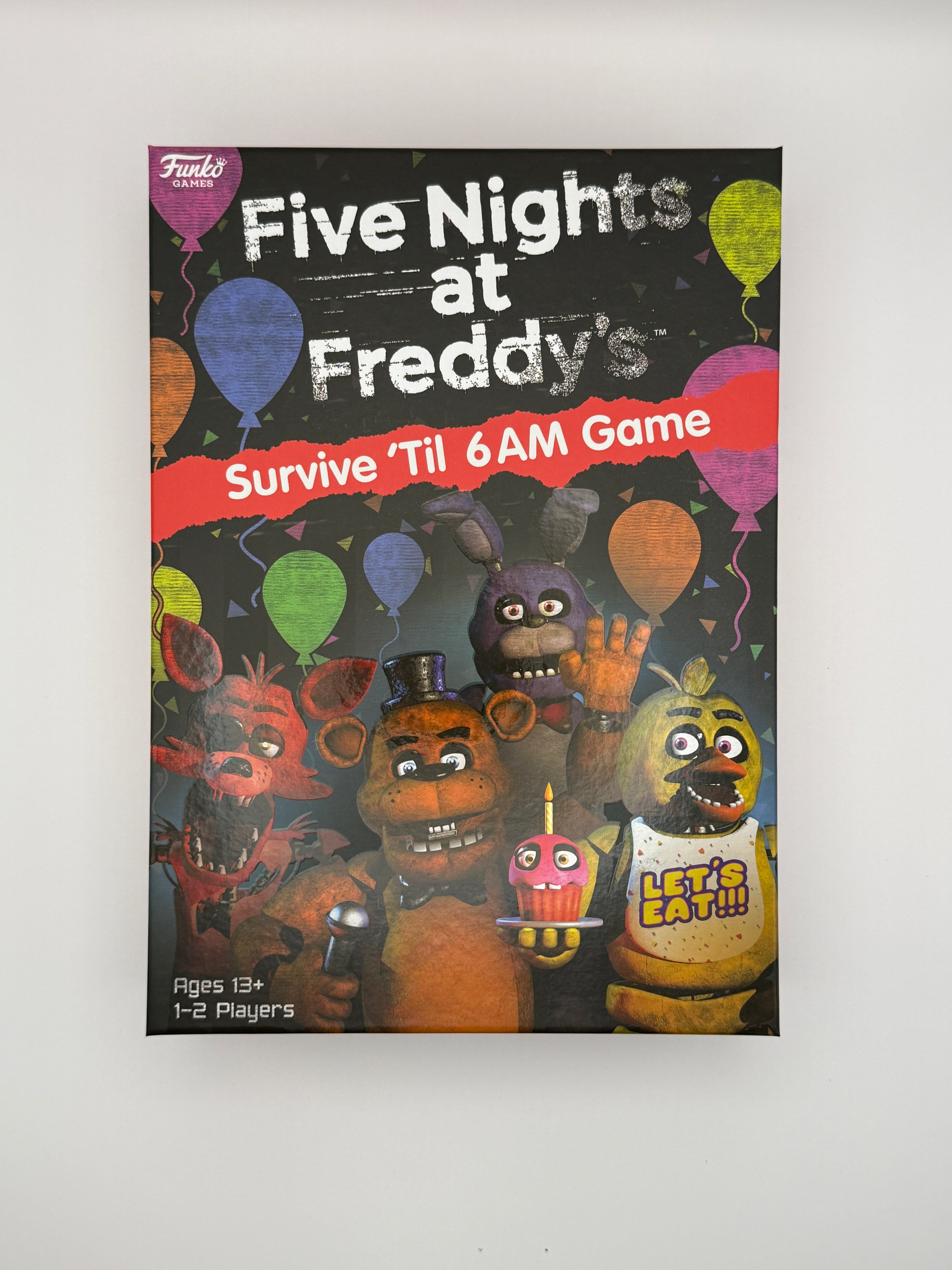 Five Nights At Freddy's Collectors Bundle Gift Set- FNAF Survive ‘Til 6am Game, 2 Mystery Figures, Gummi Pizza and Pizza Pin Badge
