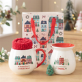 Home for Christmas gift set with festive mug, red socks, ceramic wax warmer, green tree-shaped wax melt and Christmas Street gift bag.