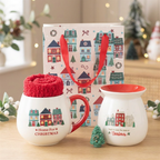 Home for Christmas gift set with festive mug, red socks, ceramic wax warmer, green tree-shaped wax melt and Christmas Street gift bag.