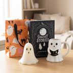 Ghost Stories Night In gift set with ghost mug, unlit ghost candle, book-shaped storage box and orange ghost-print gift bag.